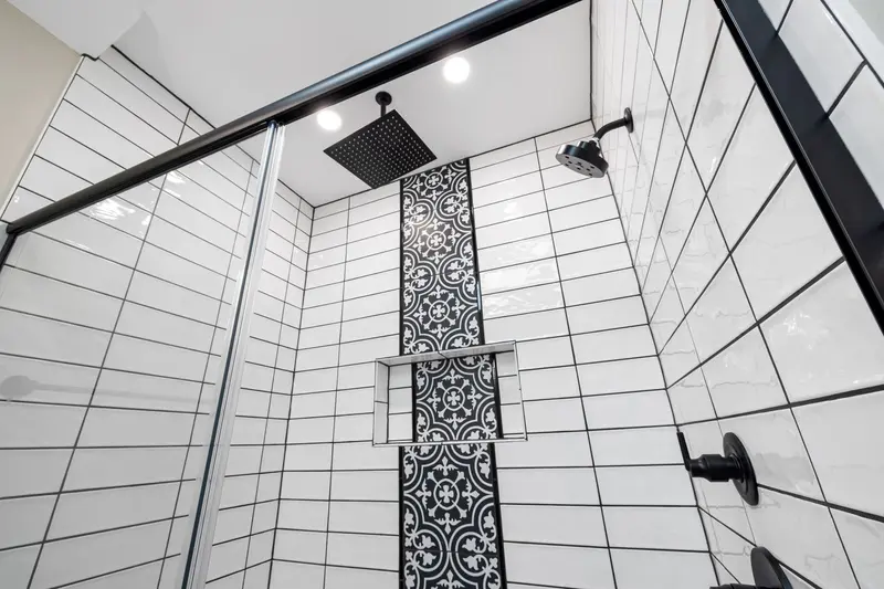 New shower fixture installed during bathroom remodel